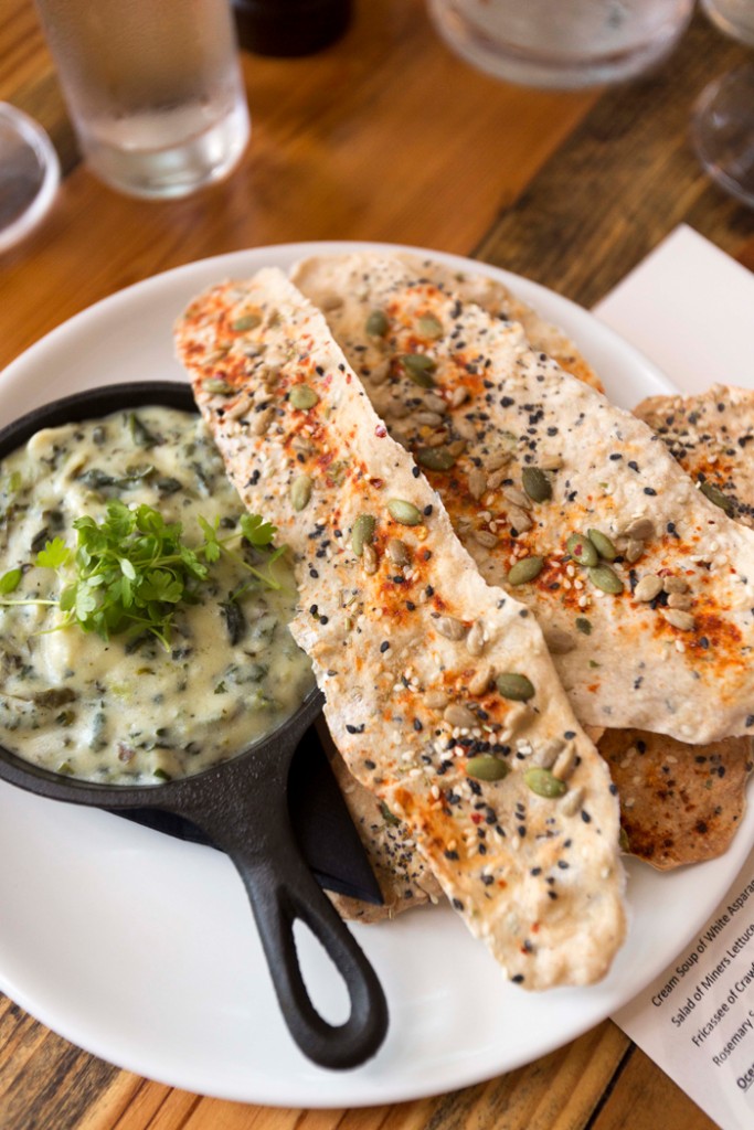 ricotta-spinach dip with basil-garlic crackers tempt the palate