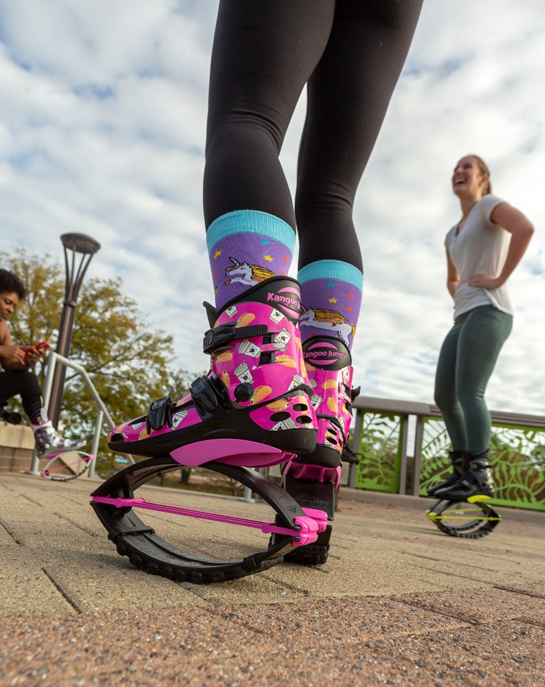 kangoo jumping fitness women team in boots. close up shot with blurred  background. black and pink colours boots Stock Photo - Alamy